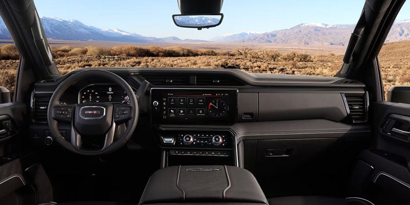 Driver-focused cockpit of the 2026 GMC Sierra 2500 HD SLT with advanced safety features